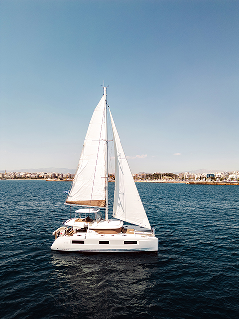 Sailing gracefully, Mary Grace II showcases its elegant profile against a clear blue sky.