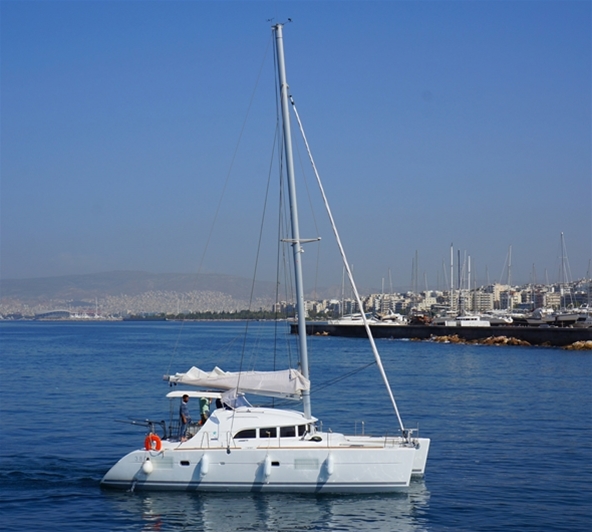 Sleek profile of Dido gliding through calm waters, showcasing elegant lines and serene surroundings.