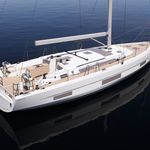 Sleek profile of Thalis II gliding over calm waters, showcasing elegant design and craftsmanship.