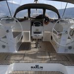 Sleek interior helm of Marlin featuring elegant wood flooring and modern navigation equipment.
