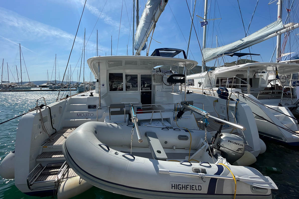 Sleek profile of Mojito at the marina, showcasing its elegant design and tender.