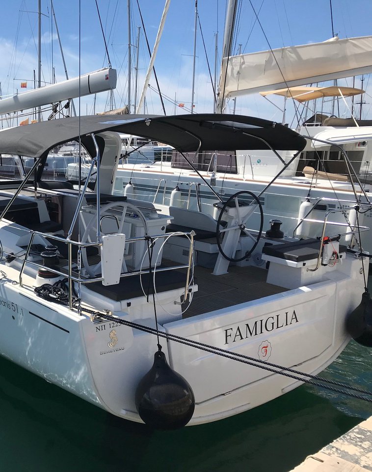 Sleek exterior of Famiglia showcasing modern design and luxurious amenities at the marina.