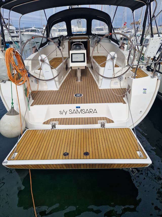 Samsara's elegant stern features a teak deck and spacious swim platform for relaxation.
