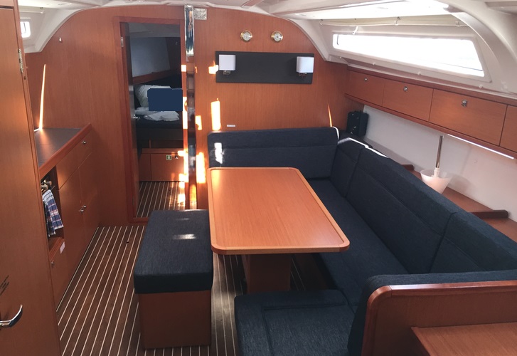 Spacious interior of Dioni featuring elegant wood finishes and ample natural light.