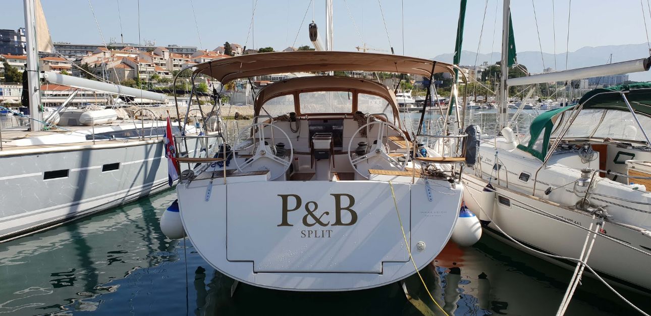 Elegant stern view of the P & B yacht showcasing its sophisticated design and luxurious ambiance.