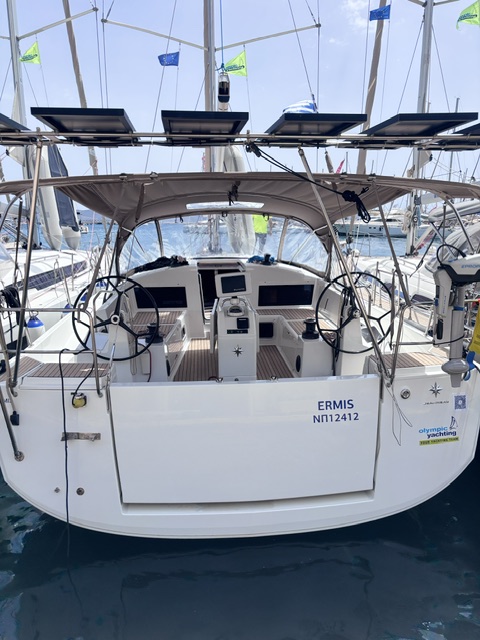 Spacious helm station of the Ermis, featuring dual steering wheels and modern navigation equipment.