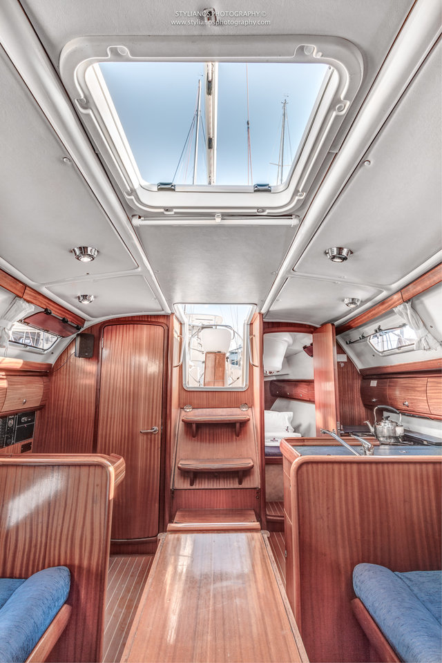 Luxurious interior of Aias featuring rich wood finishes and ample natural light.